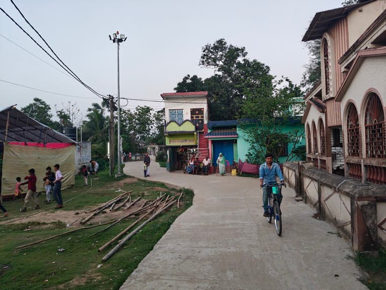 The last shared ground in Ghatkuri, photographed at dusk. (Demo photograph.)